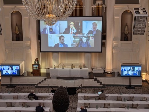 Three Screen set up with panel seating and lectern